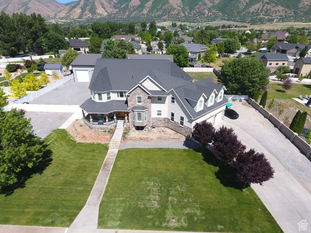 Aerial perspective of suburban area featuring a mountain backdrop