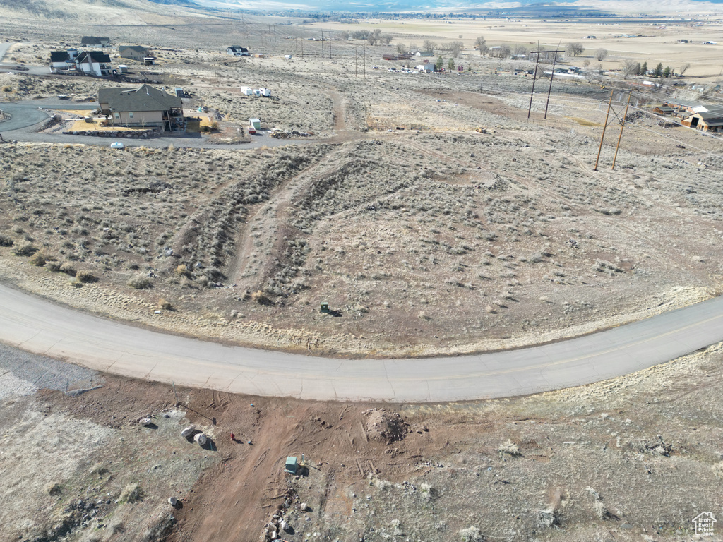 Aerial view of property's location featuring mountains and rural landscape