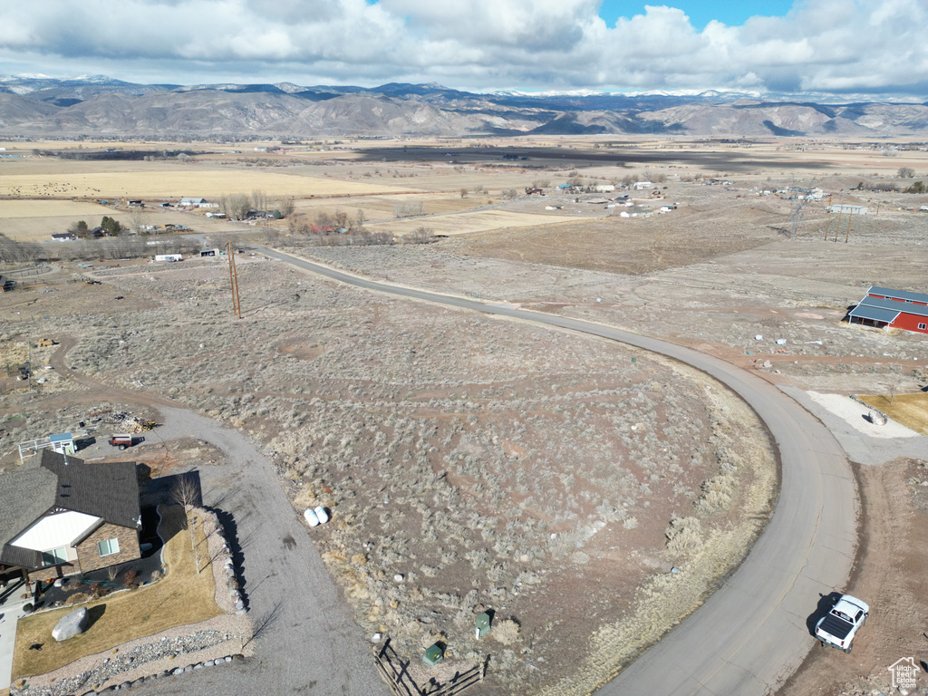 View of rural area featuring a mountainous background and a desert landscape