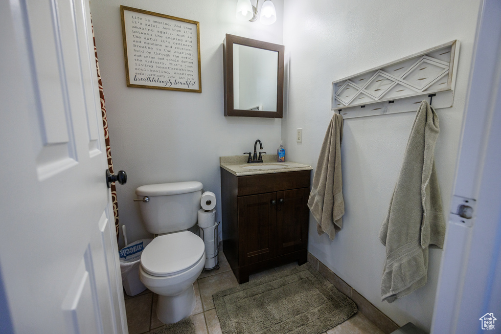 Bathroom with vanity and tile patterned flooring