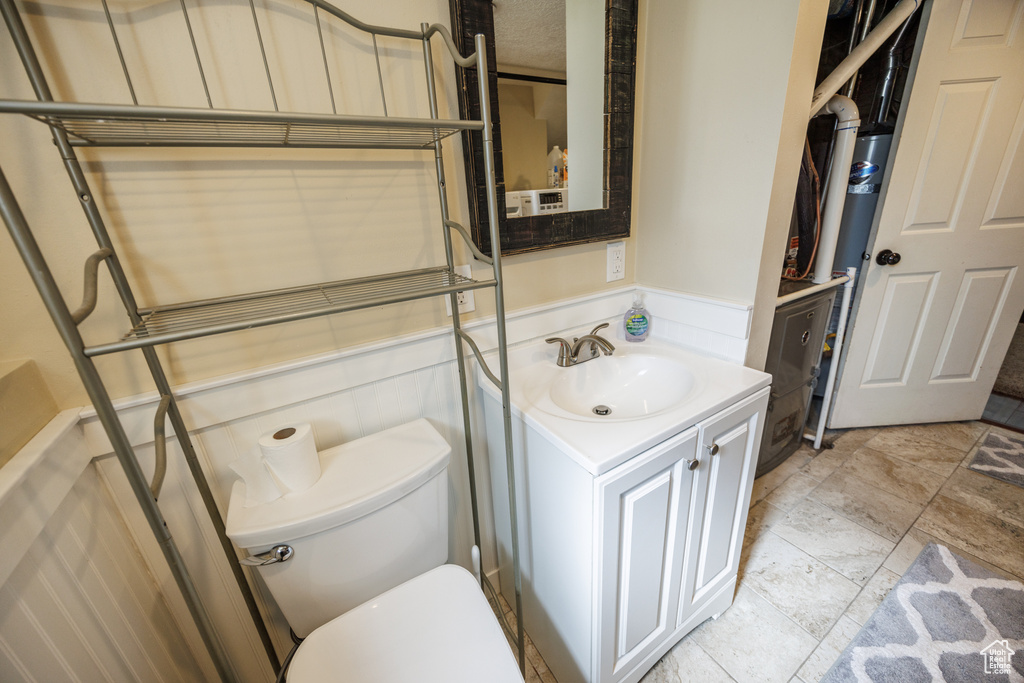 Bathroom featuring vanity and a wainscoted wall