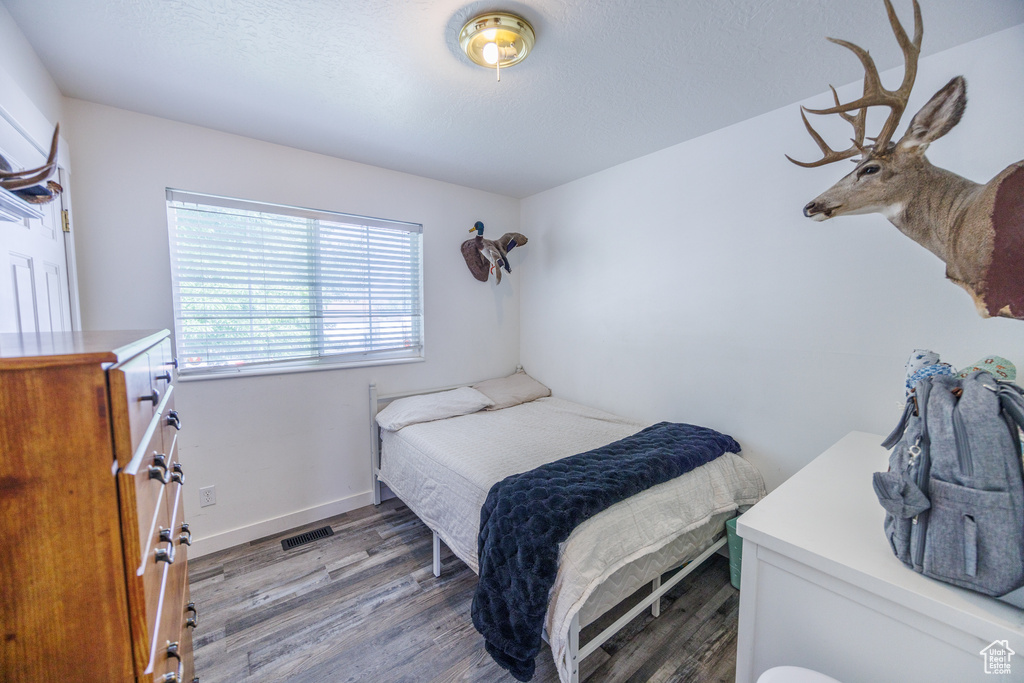 Bedroom featuring wood finished floors