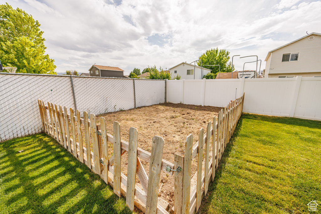 View of fenced backyard