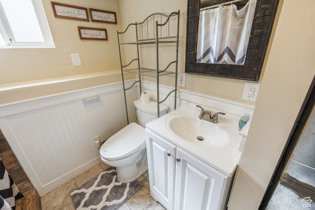 Full bath featuring toilet and vanity