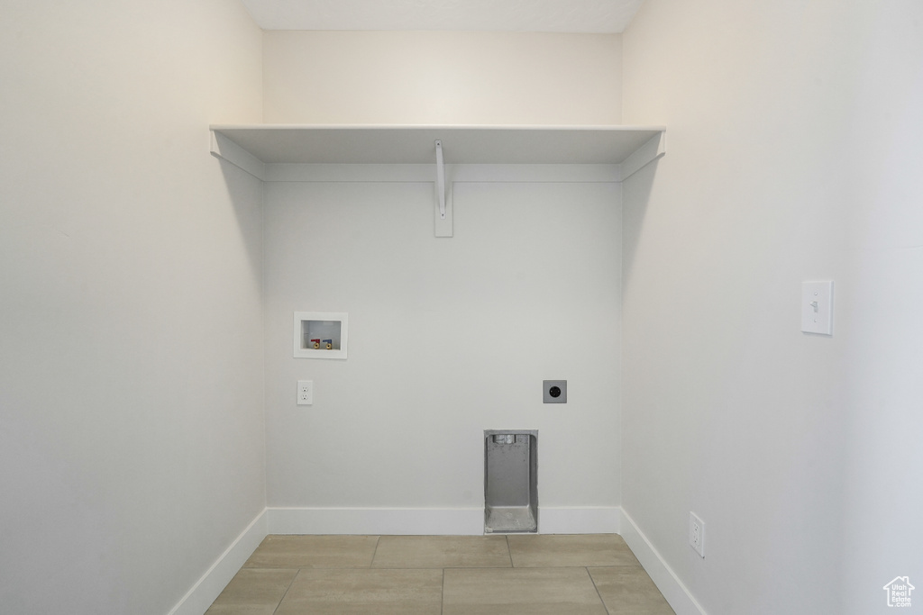 Laundry area featuring hookup for a washing machine and hookup for an electric dryer