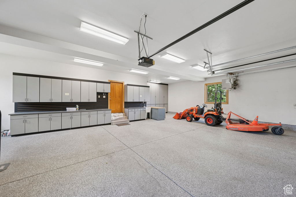 Garage featuring a garage door opener