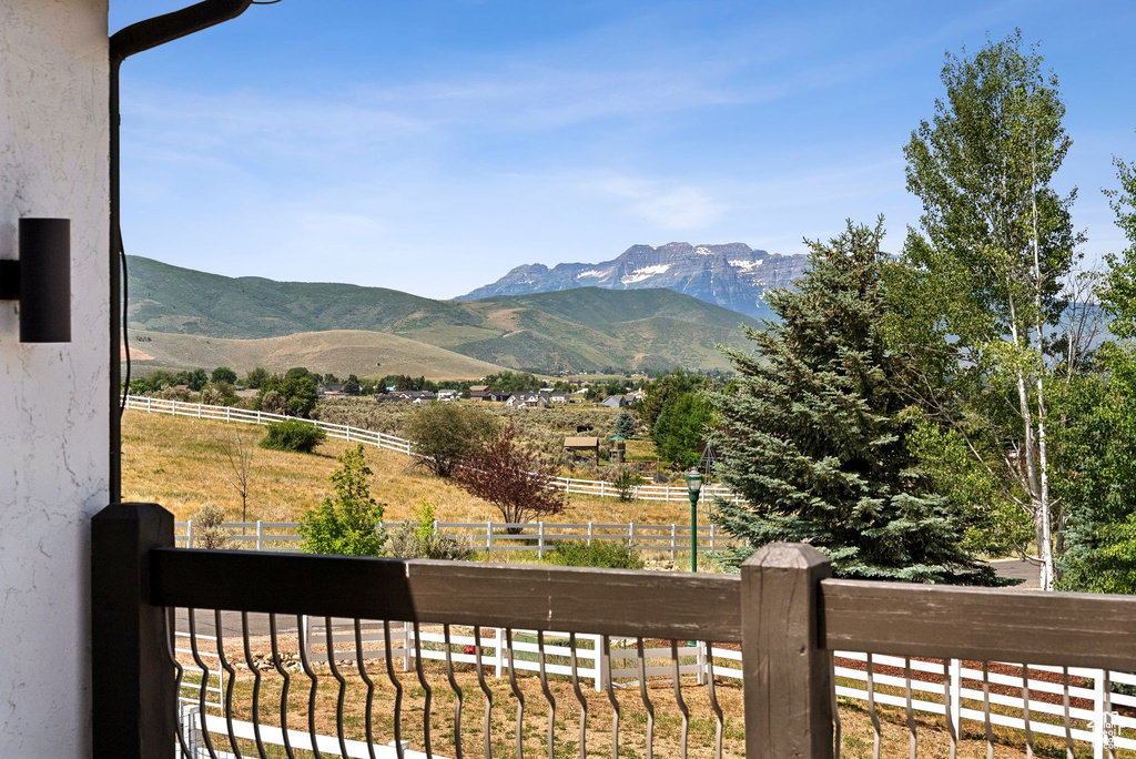View of mountain backdrop with rural landscape