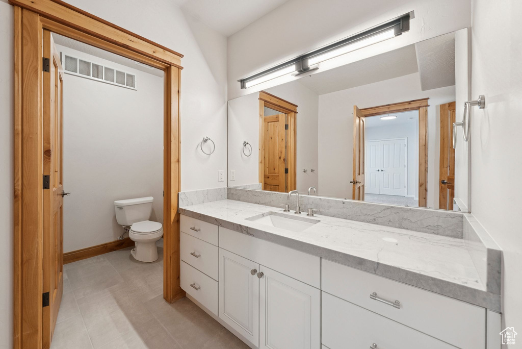 Bathroom with vanity and toilet
