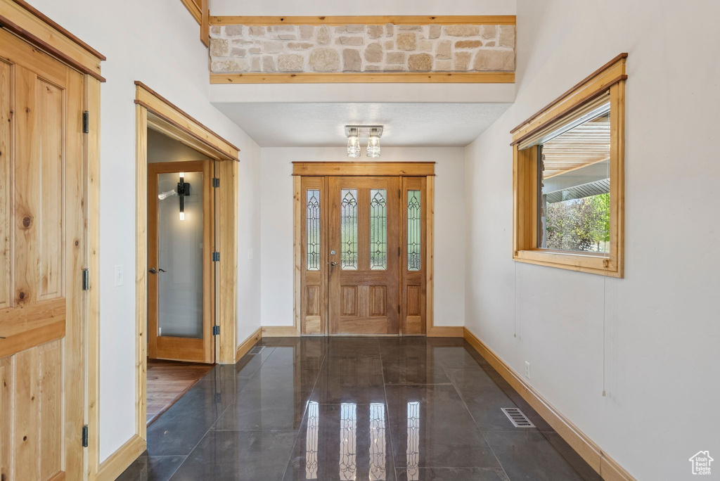 Entrance foyer featuring baseboards