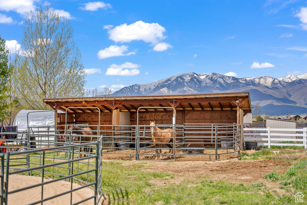 Horse barn featuring a mountain view