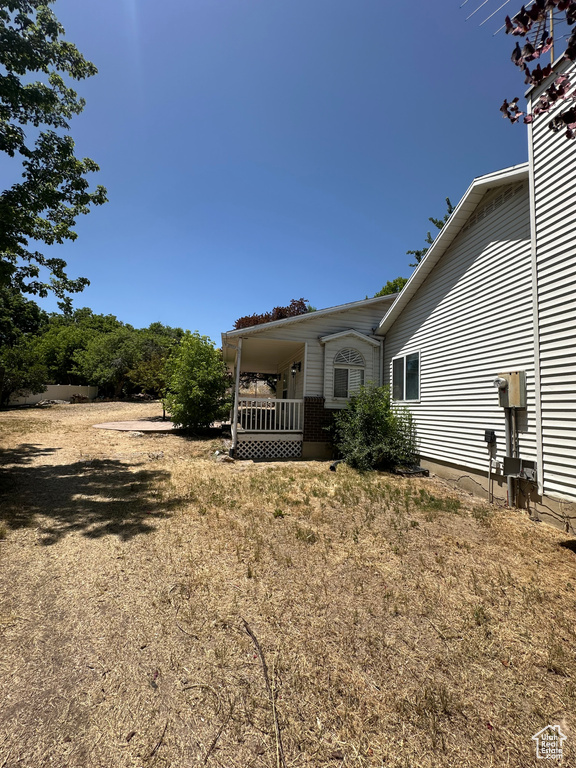 Rear view of property with a porch