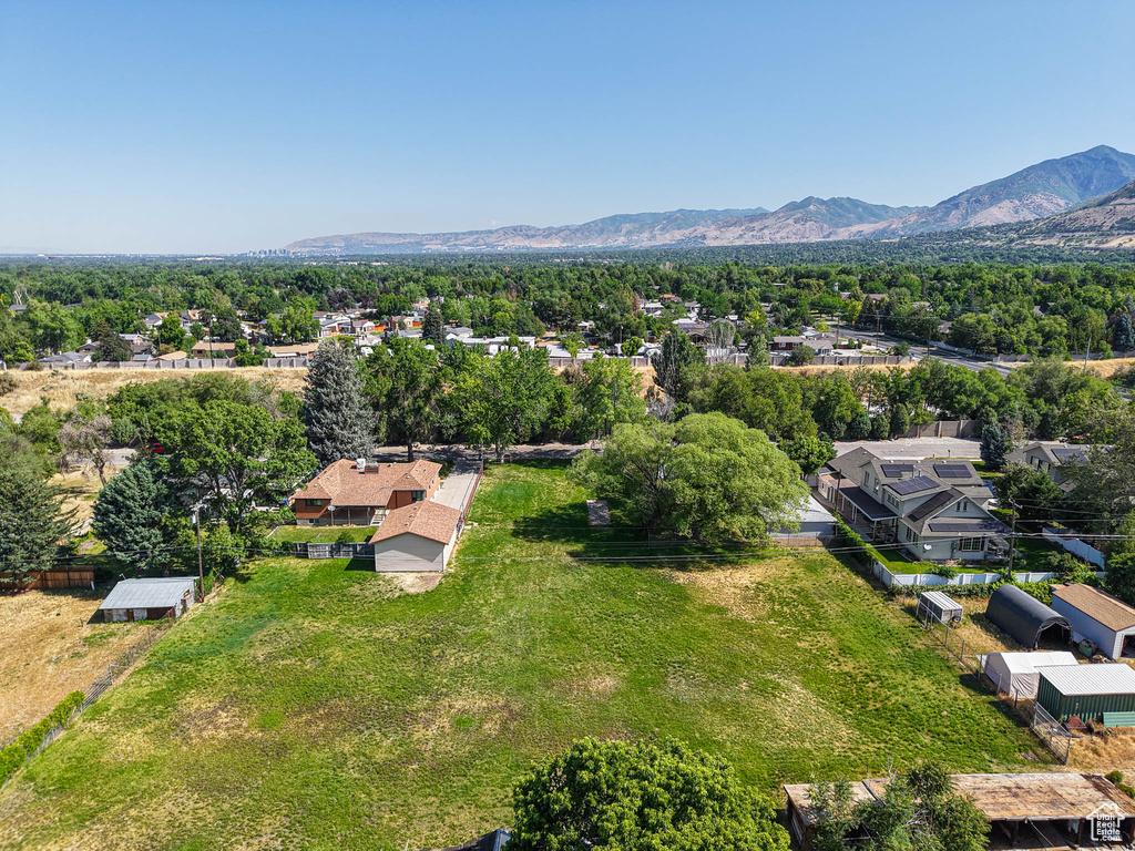 Aerial perspective of suburban area with a mountain backdrop