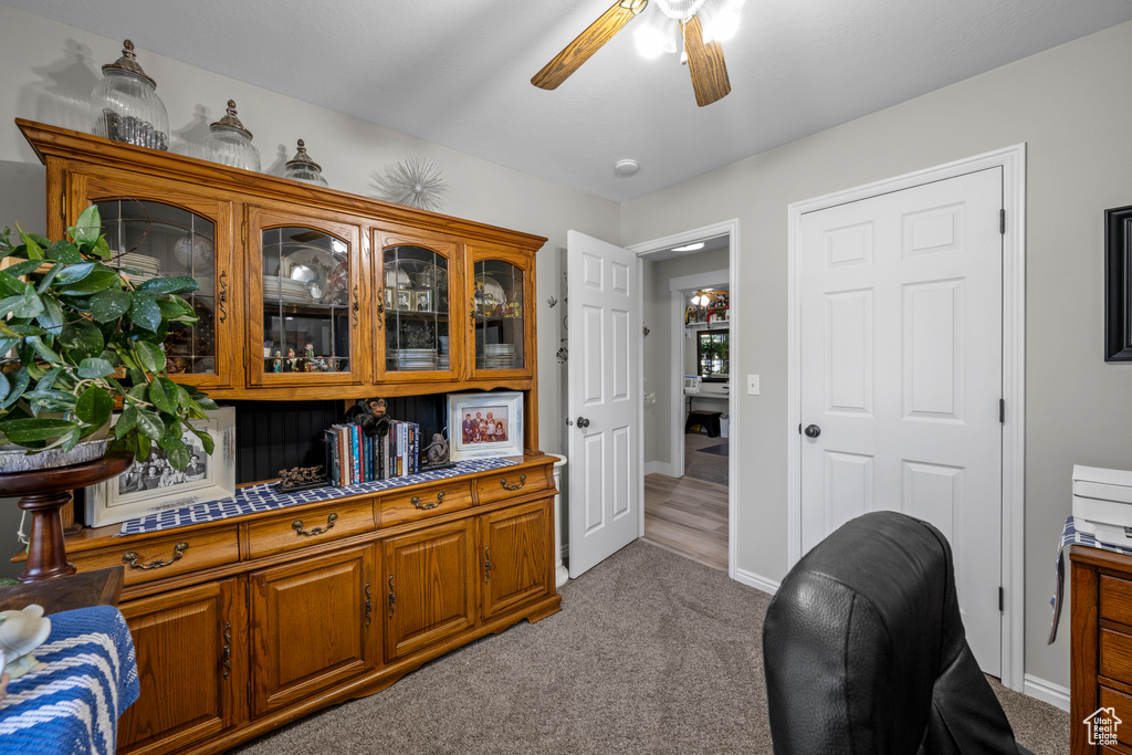 Office featuring a ceiling fan and carpet flooring