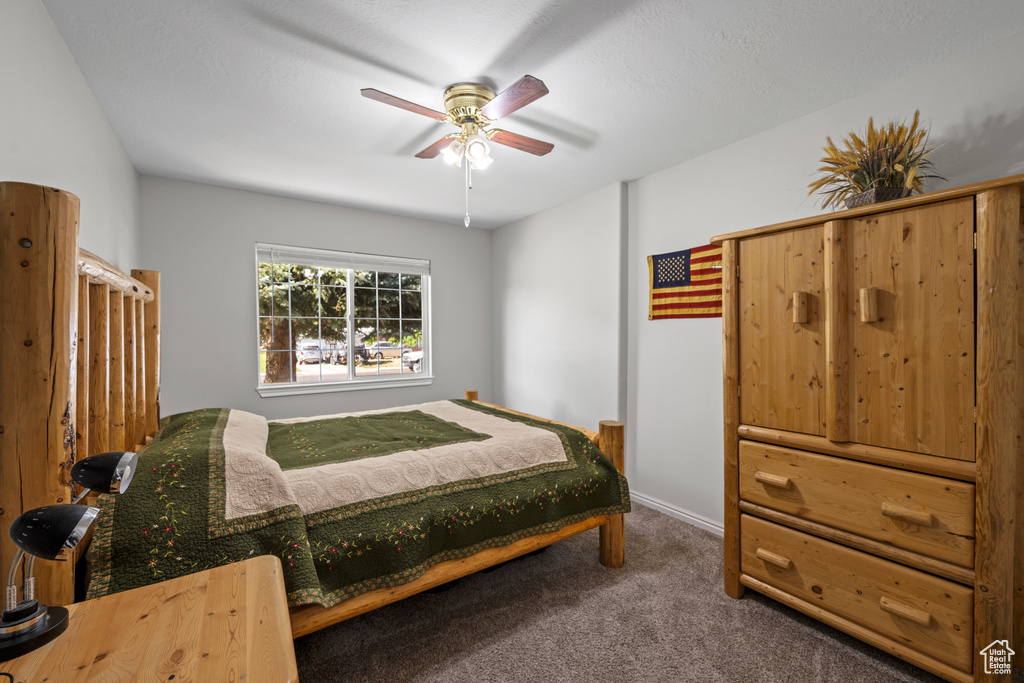 Bedroom featuring carpet flooring and a ceiling fan