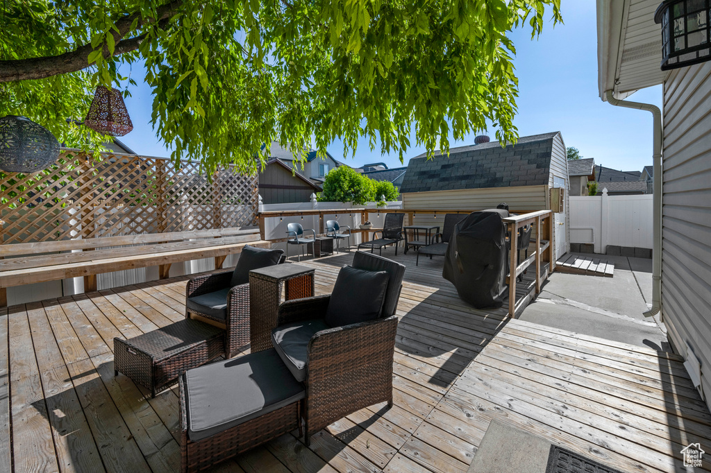Wooden deck featuring a fenced backyard and outdoor dining area