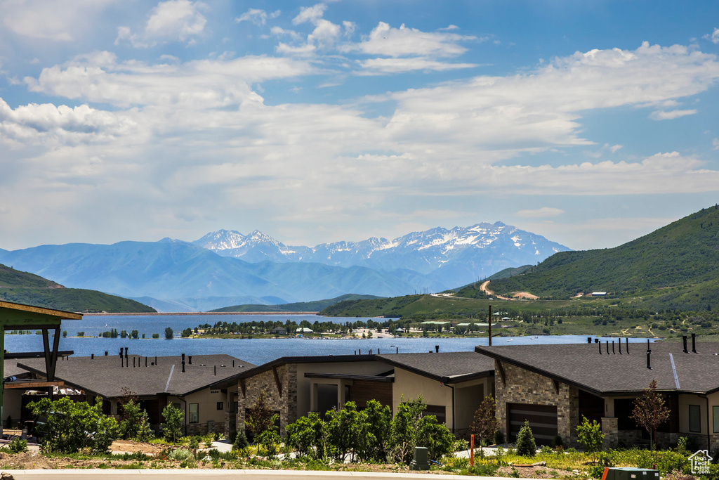 View of mountain backdrop featuring a nearby body of water