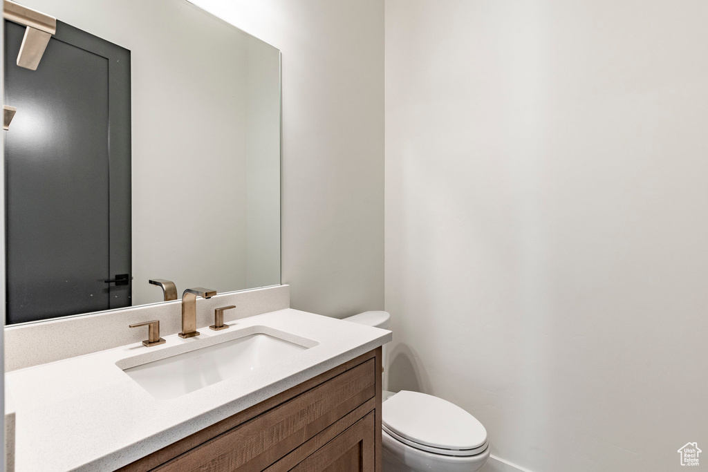 Bathroom with toilet and vanity