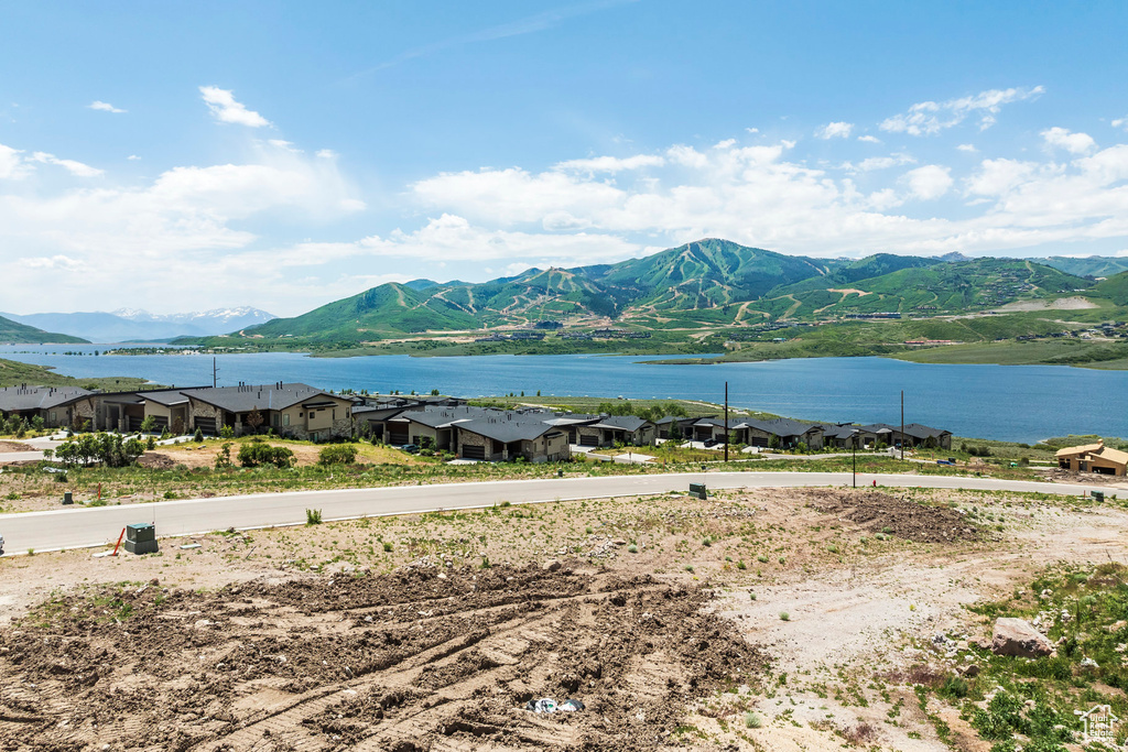 Mountain view featuring a nearby body of water