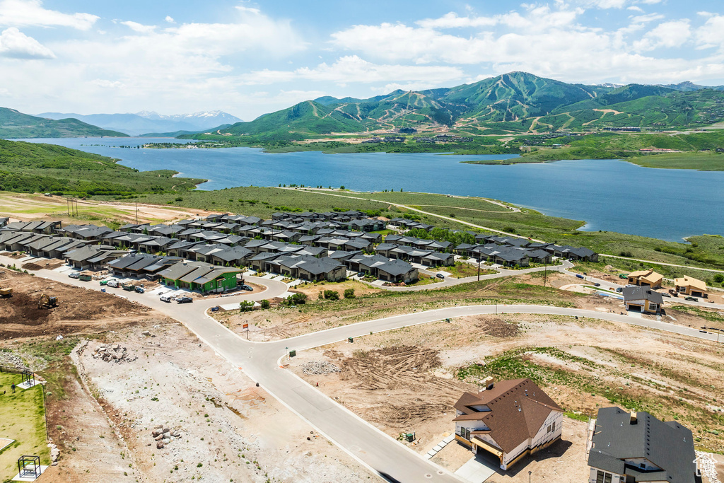 Aerial perspective of suburban area featuring a water and mountain view