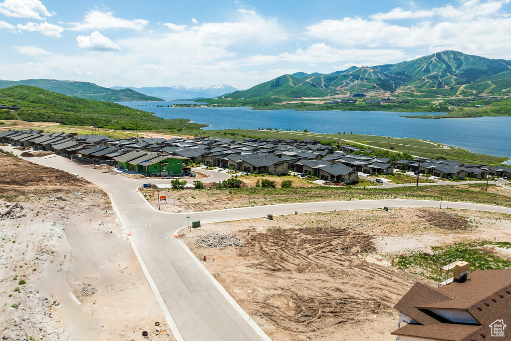 Aerial view of residential area featuring a water and mountain view
