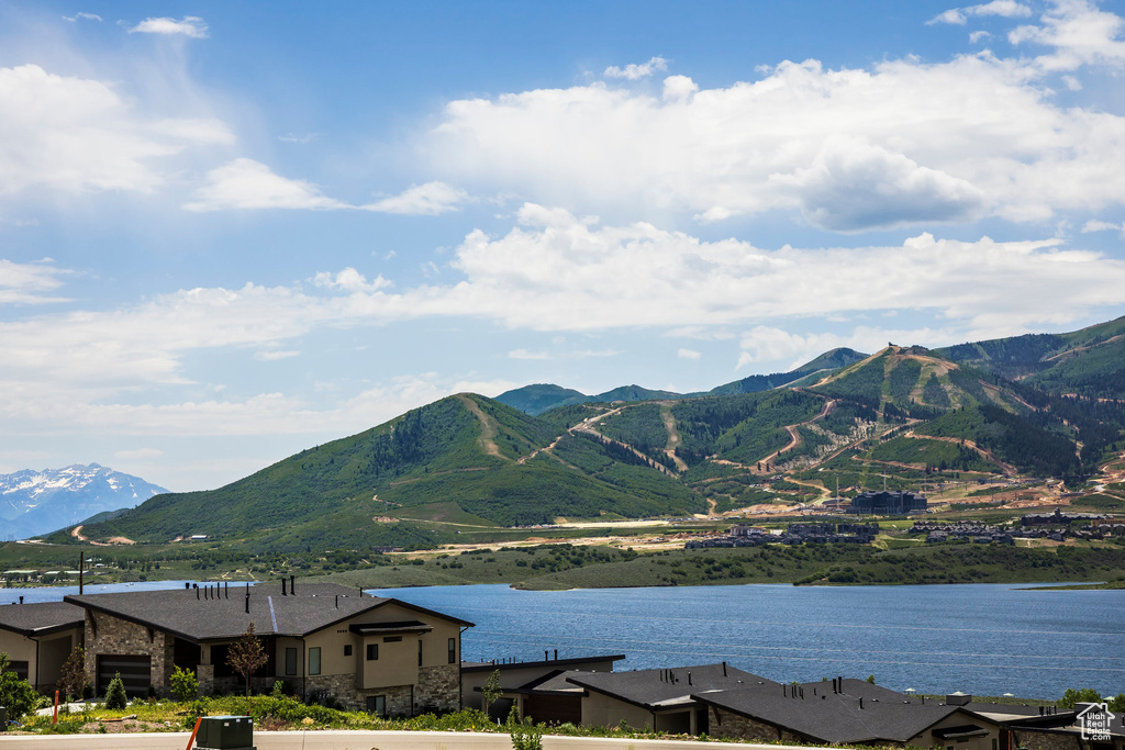 Mountain view featuring a nearby body of water