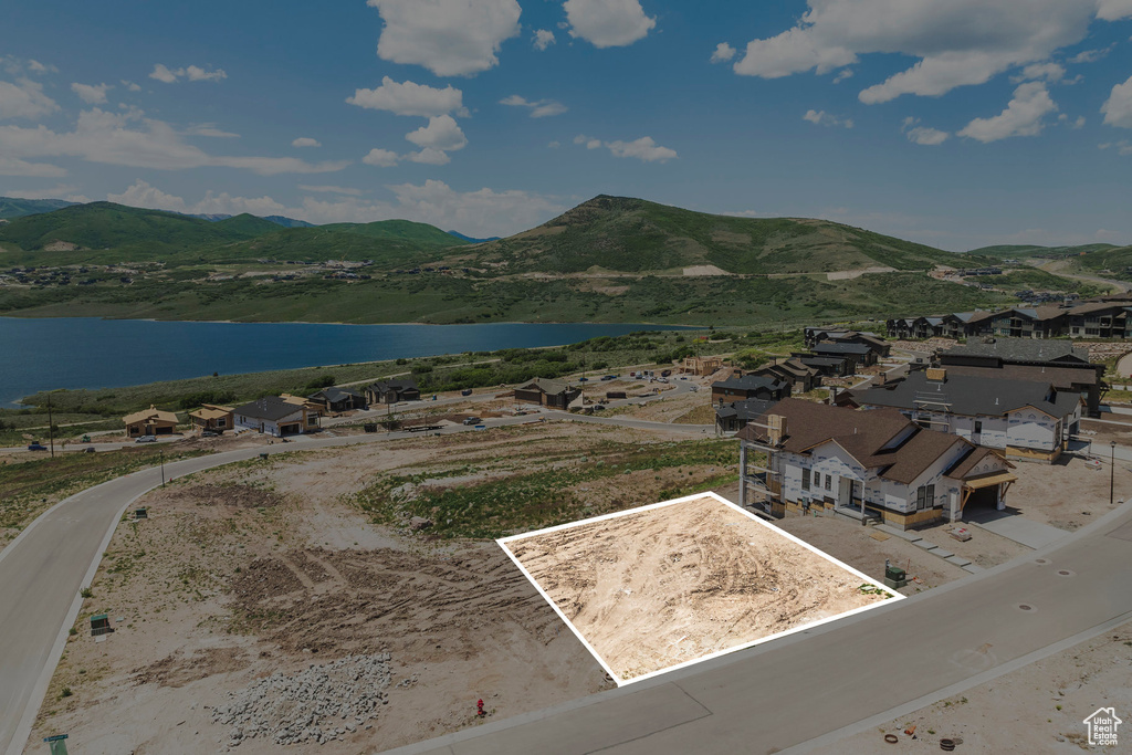 View of property location featuring a water and mountain view and property parcel outlined