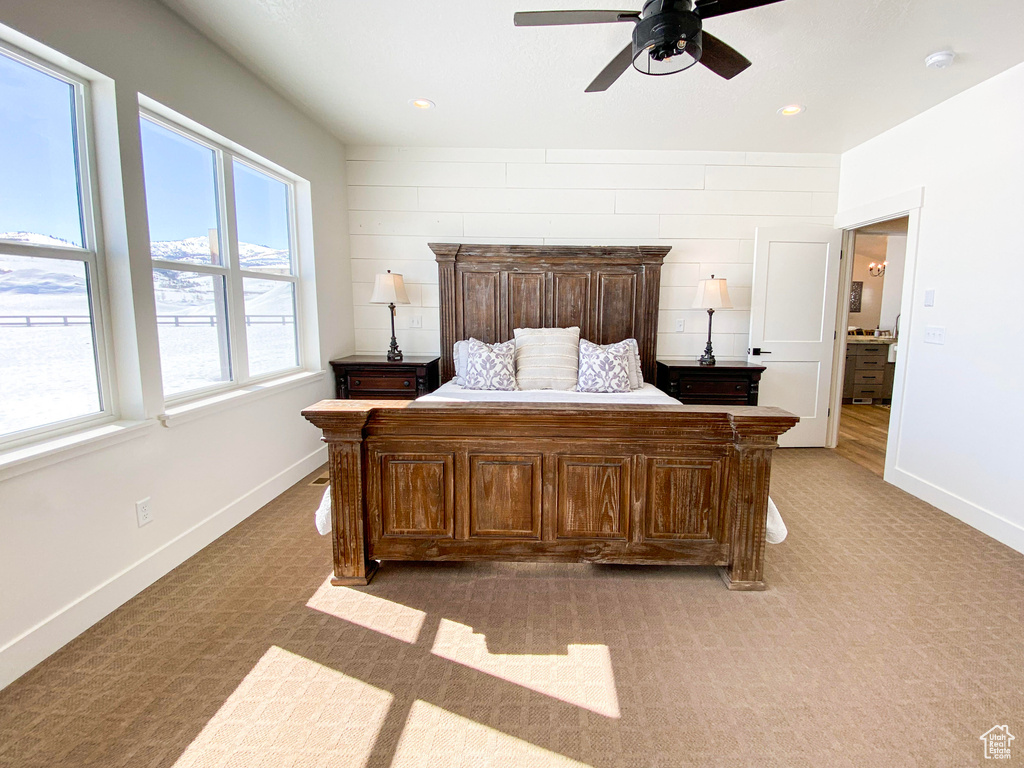 Bedroom featuring light carpet, ceiling fan, and recessed lighting