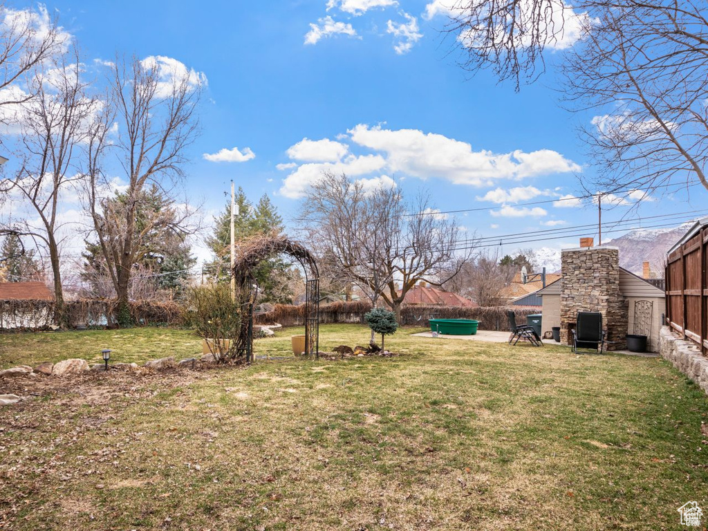 View of fenced backyard