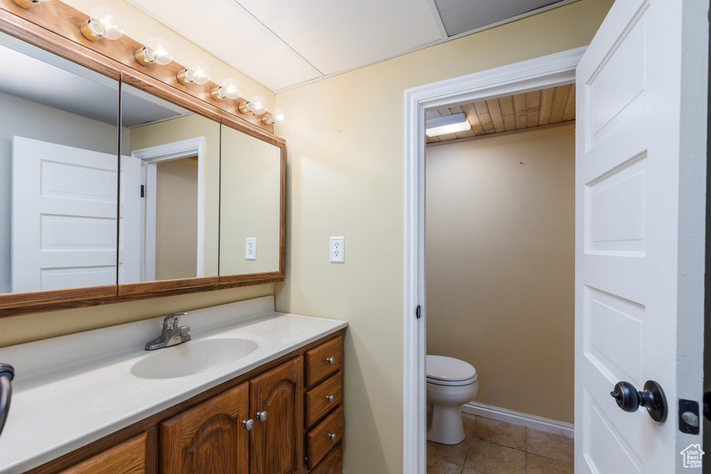Bathroom featuring vanity and tile patterned flooring
