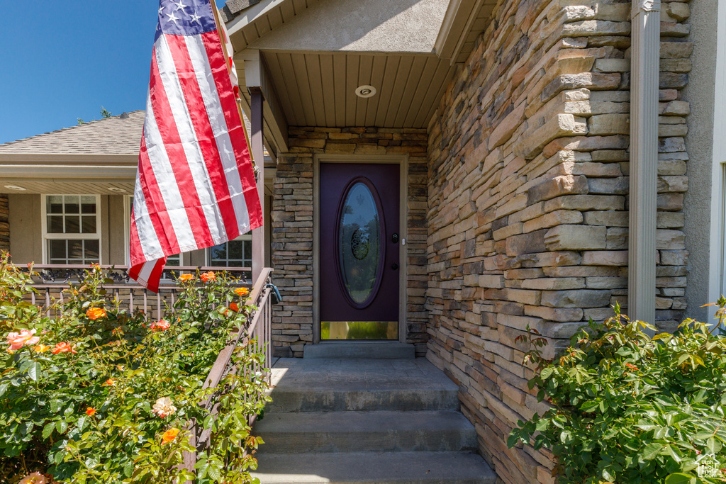 Property entrance featuring stone siding
