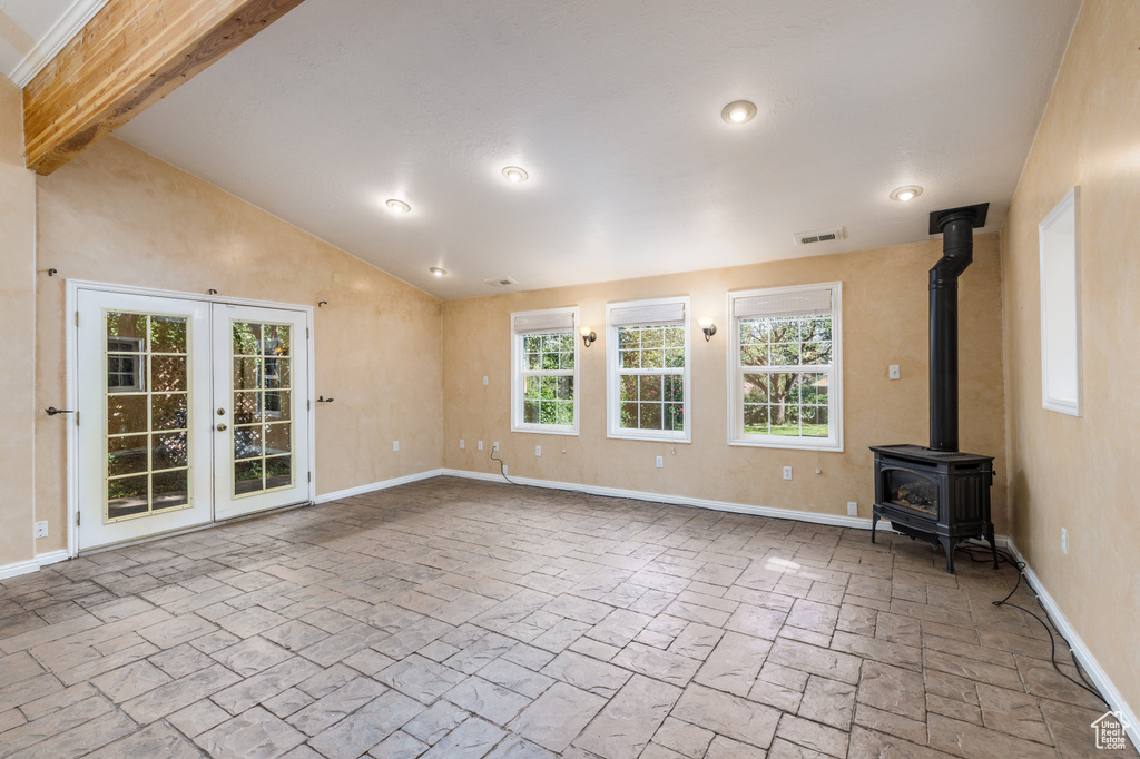 Spare room with a wood stove and french doors