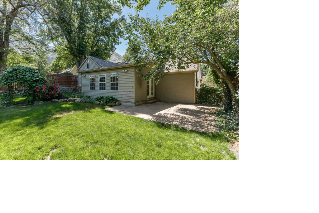 Rear view of property with a patio