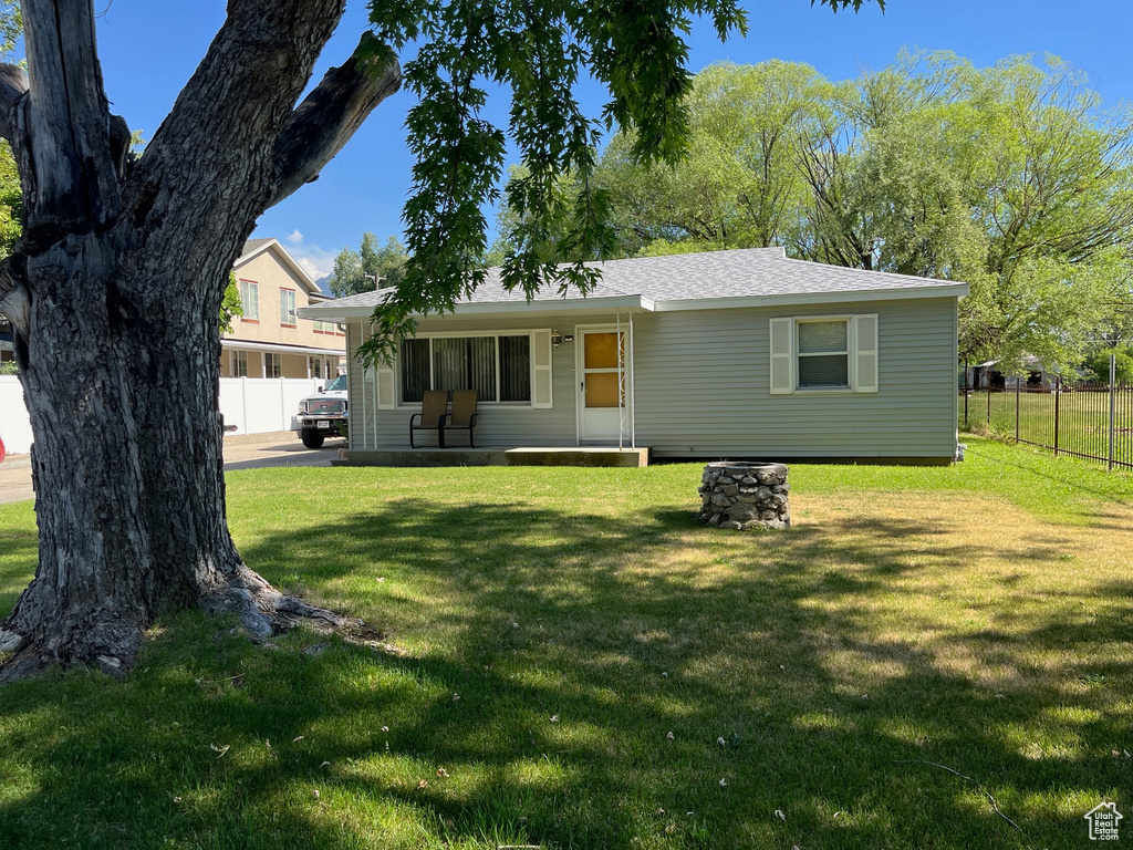 View of front of house featuring a porch and roof with shingles
