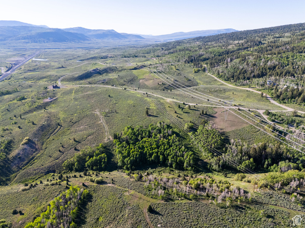 Aerial overview of property's location featuring a mountainous background