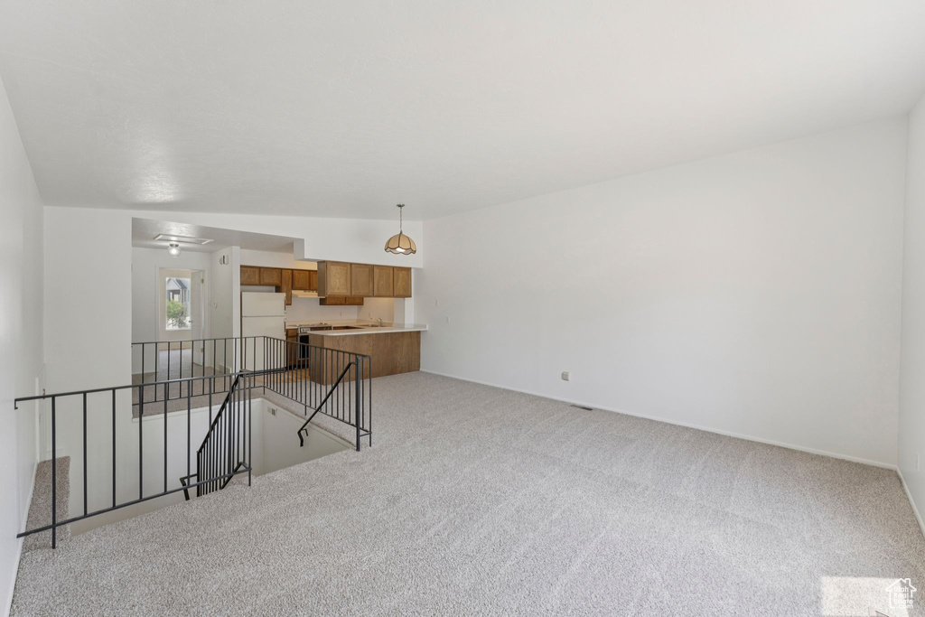 Unfurnished living room with carpet