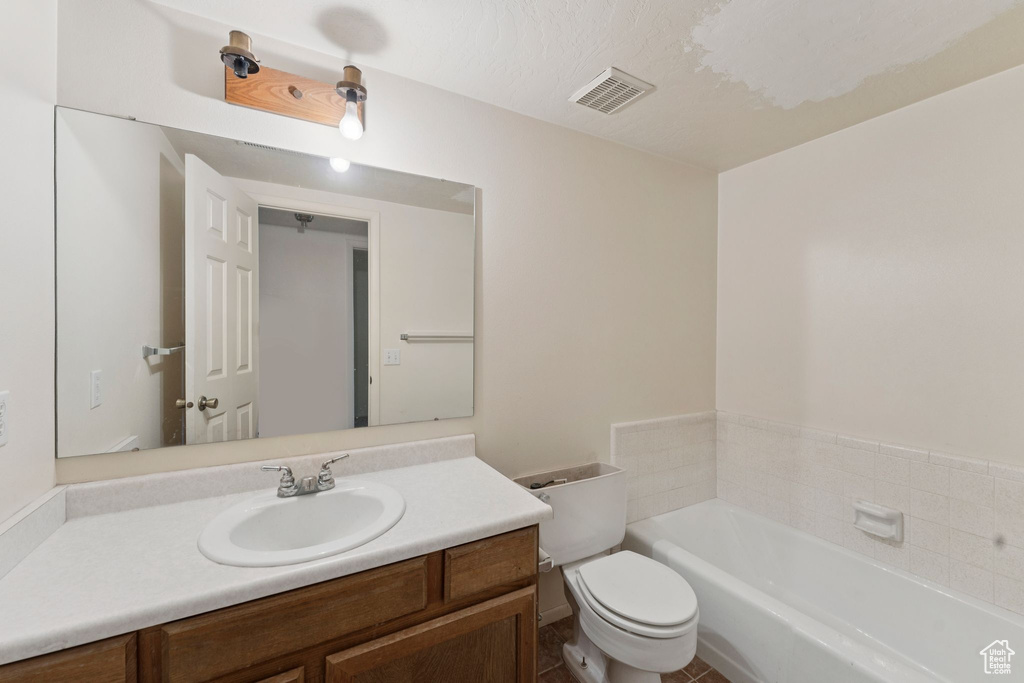 Full bathroom with a garden tub and vanity