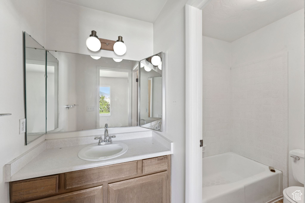 Bathroom featuring vanity and bathing tub / shower combination