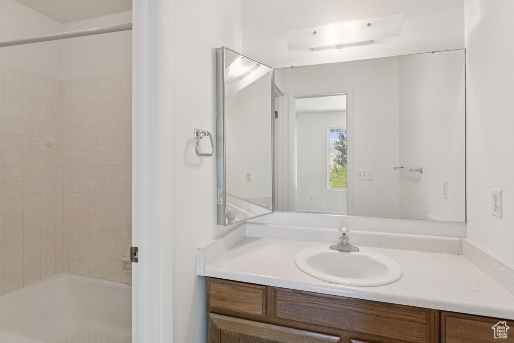 Full bathroom featuring vanity and tub / shower combination