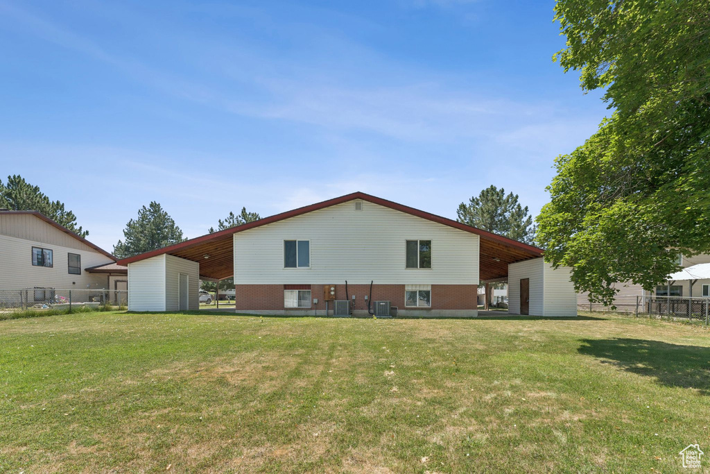 Back of house featuring brick siding