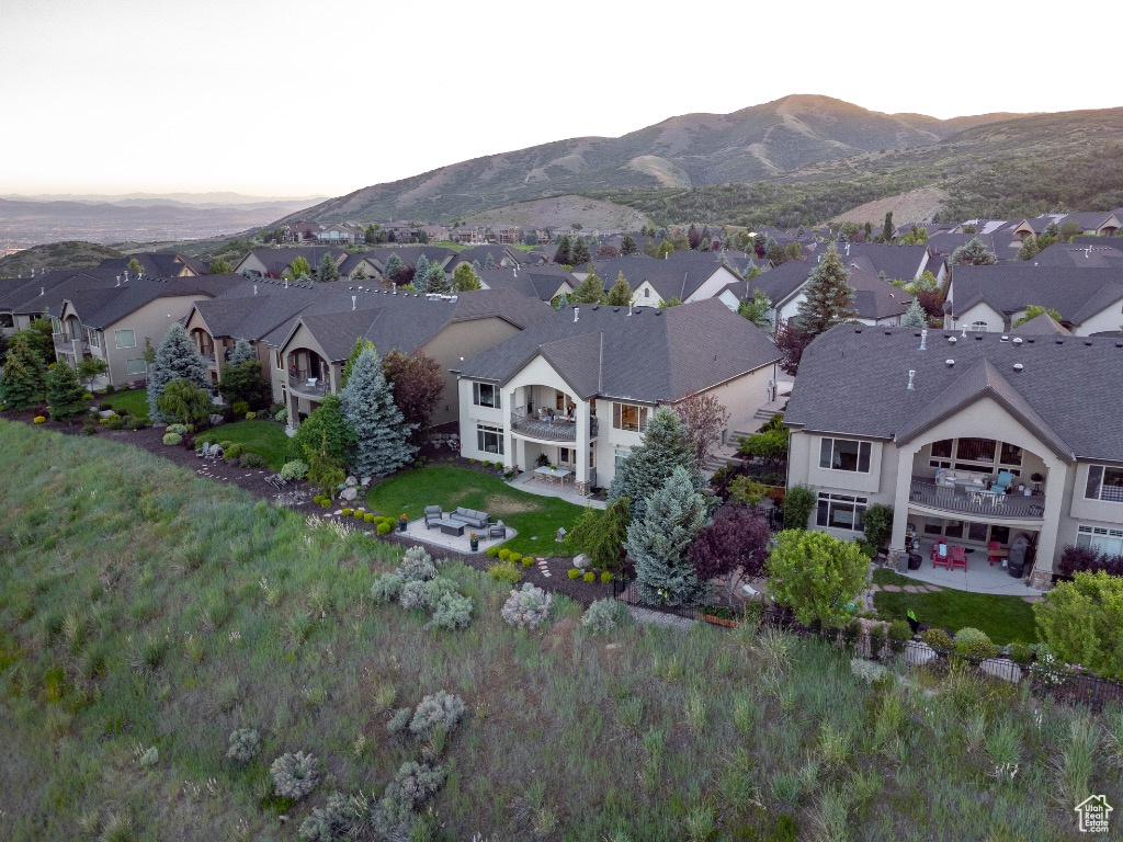 Aerial perspective of suburban area featuring a mountainous background