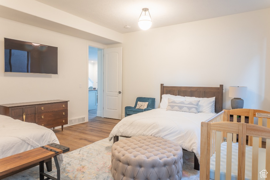 Bedroom with light wood finished floors