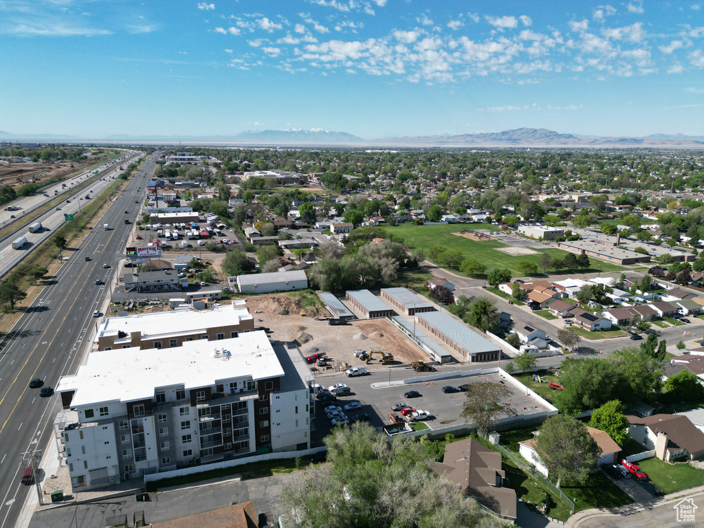 Bird\'s eye view of a main thoroughfare and a mountain backdrop