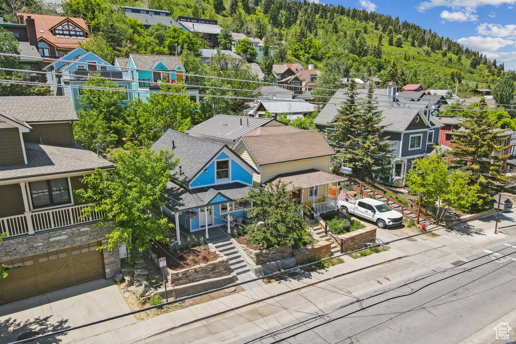 Aerial perspective of suburban area with a forest