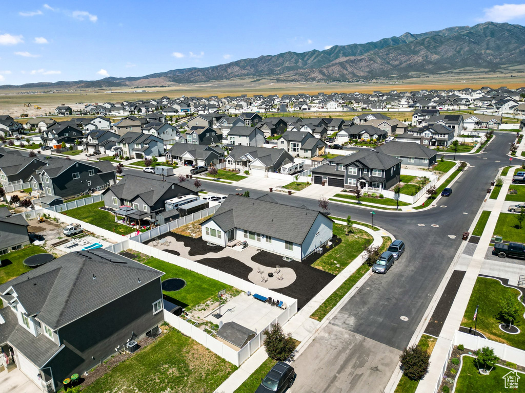 Aerial perspective of suburban area with a mountain backdrop