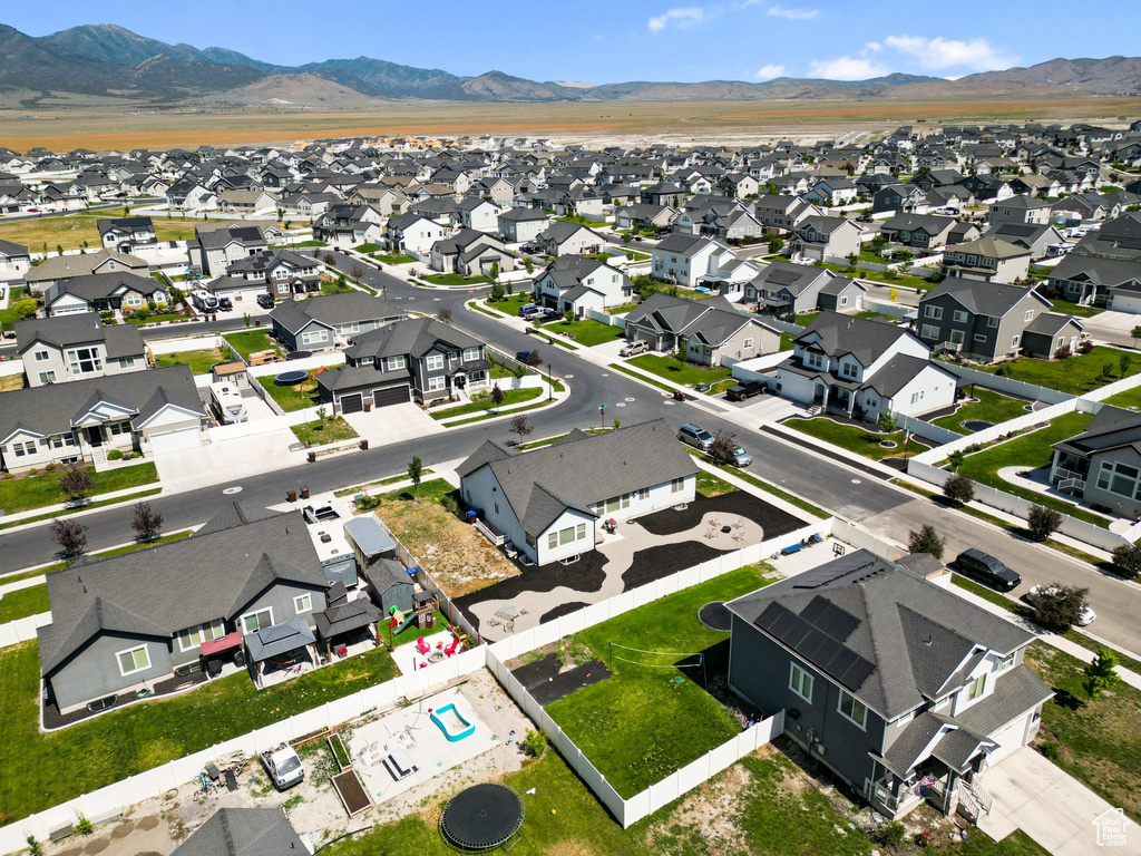 Aerial perspective of suburban area with a mountain backdrop
