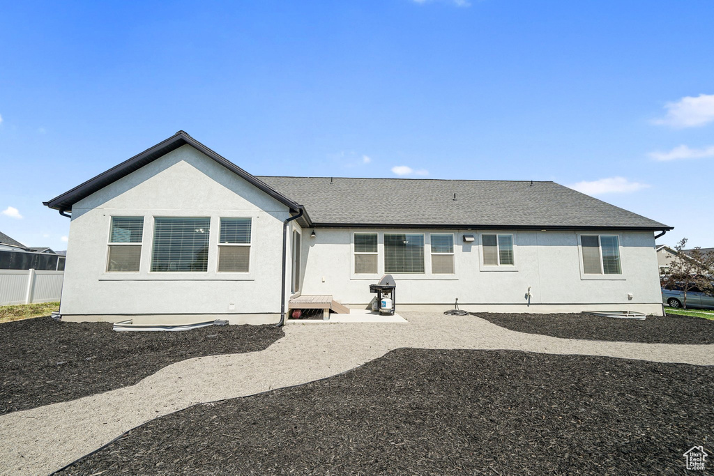 Back of house with stucco siding