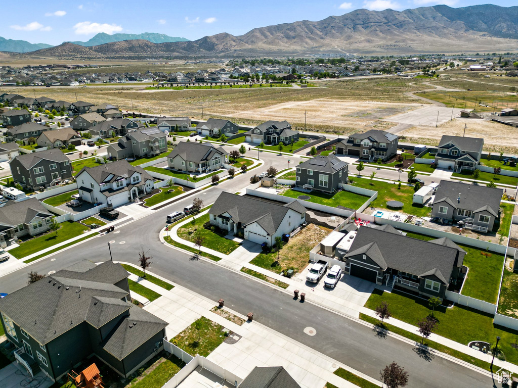 Aerial view of residential area featuring mountains