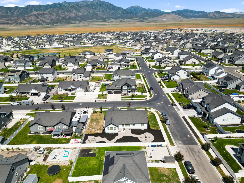 Aerial perspective of suburban area featuring a mountainous background