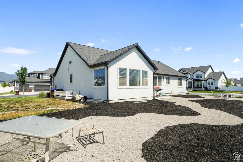 View of home's exterior with a residential view and stucco siding