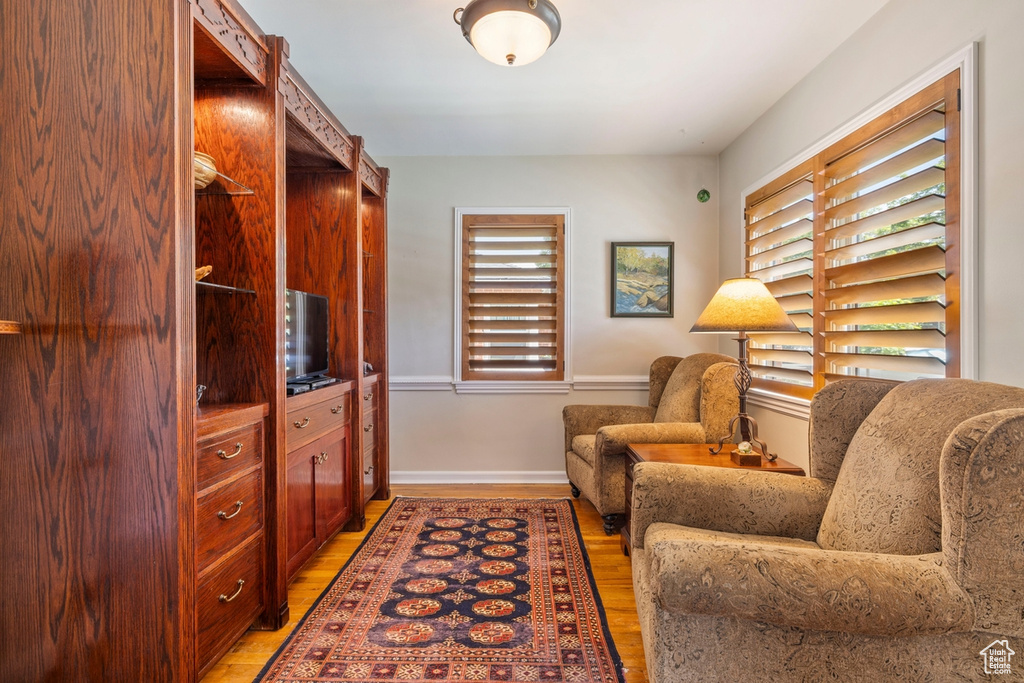 Sitting room featuring light wood-style flooring